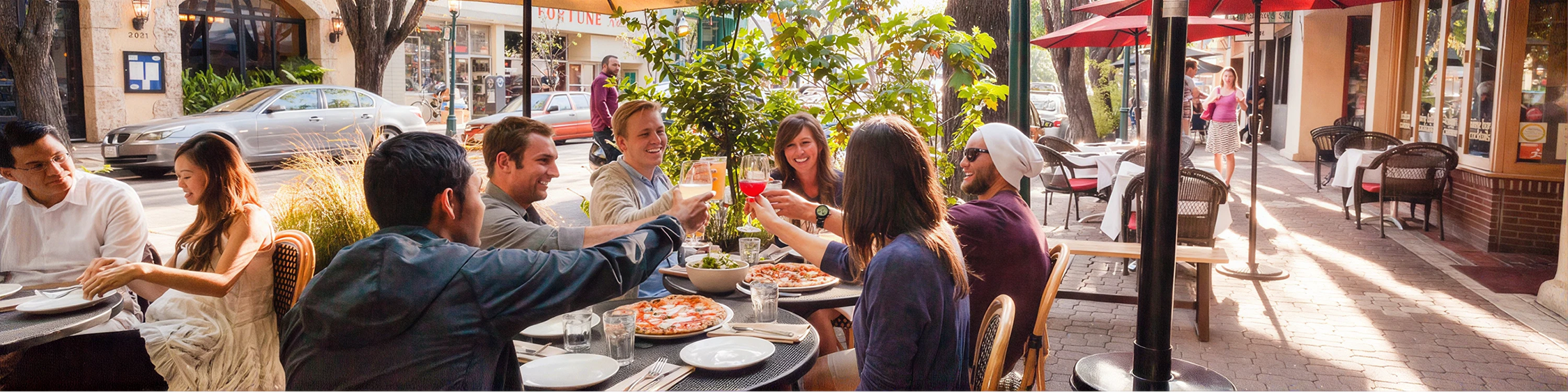 Friends toasting at outdoor restaurant